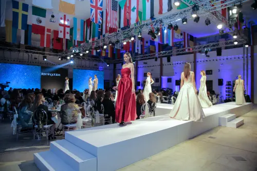 This image shows a couple of models on a runway at one of our fashion events.