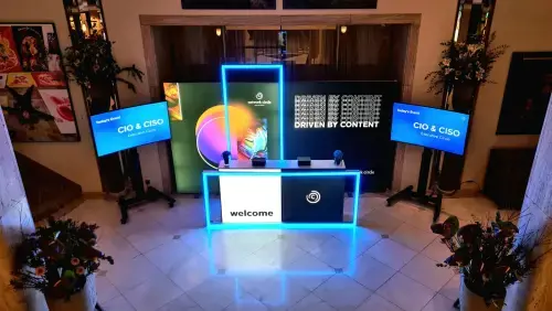 The image shows a welcome area that we built for one of our events. It includes a nice reception counter and well-thought layout design.